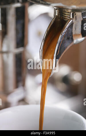 coffee extraction from professional coffee machine Stock Photo