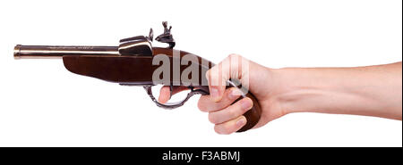 Old musket gun in male hand isolated on white background Stock Photo