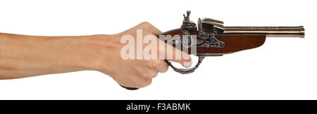 Old musket gun in male hand isolated on white background Stock Photo