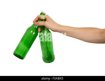 Two empty bottles of beer in a female hand isolated on white background Stock Photo