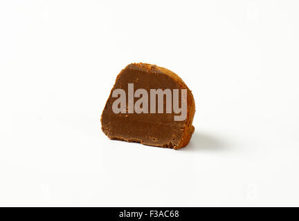 halved belgian praline with chocolate butter on white background Stock Photo