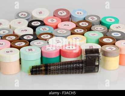 many filmstrips in plastic containers Stock Photo