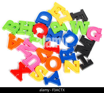 Alphabet written in multicolored plastic kids letters isolated on white background Stock Photo