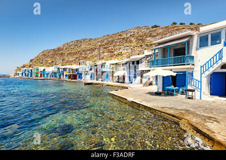 Traditional fishermen houses with the impressive boat shelters, also known as “syrmata” in Klima of Milos, Greece Stock Photo