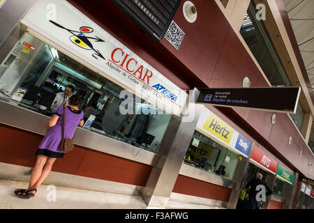Row of car hire offices in the arrivals area at Tenerife south airport. Canary Islands, Spain. Stock Photo