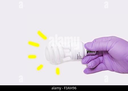 Hand Held CFL Spiral Energy Saving Light Bulb E27 Stock Photo
