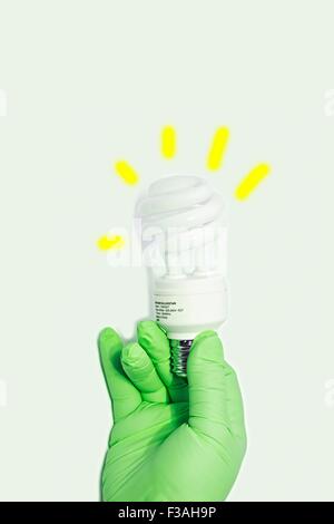 Hand Held CFL Spiral 13W 50W Watt Energy Saving Light Bulb E27 Stock Photo