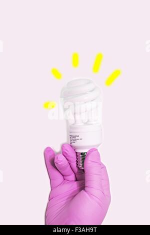 Hand Held CFL Spiral 13W 50W Watt Energy Saving Light Bulb E27 Stock Photo