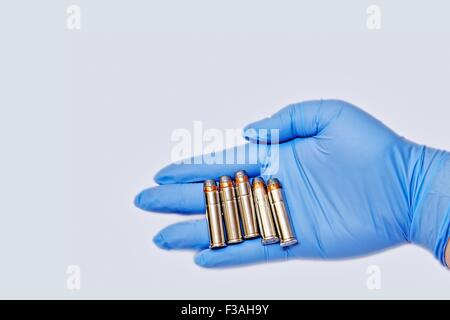 Hand Held 357 Magnum Cartridges Latex Glove 5 Stock Photo