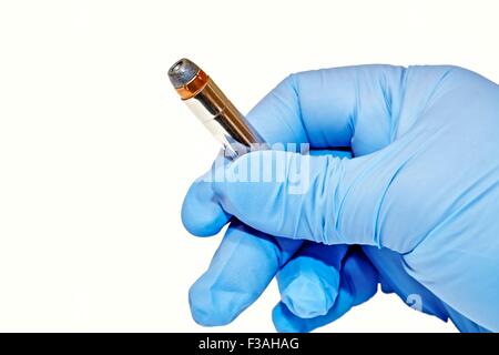 Hand Held 357 Magnum Cartridge Latex Glove Stock Photo