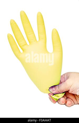 Hand Holding Blown Up Latex Glove Yellow Stock Photo
