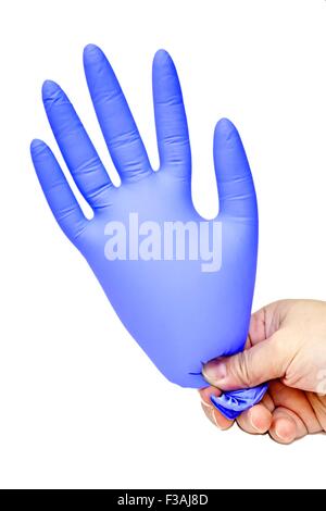 Hand Holding Blown Up Latex Glove Purple Stock Photo