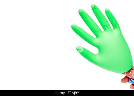 Hand Holding Blown Up Latex Glove Green Stock Photo