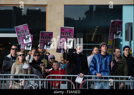 Edinburgh, Scotland 3rd of October 2015. Scottish Defence league held a protest against immigration but were met by a larger counter protest group carrying signs saying 'Nae Nazis'. The SDL protested next to a Duke of Wellington statue where as the other group where held on Princess Street by the police. Credit:  Andrew Steven Graham/Alamy Live News Stock Photo