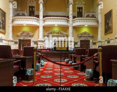 Senate Chamber carpet red and white, the Crossland colors of the Maryland Flag. Woven into the carpet is the Great Seal of 1648 Stock Photo