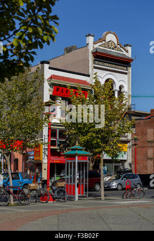Tall nineteenth century buildings forming part of Chinatown in Victoria, British Columbia is the oldest Chinatown in Canada Stock Photo