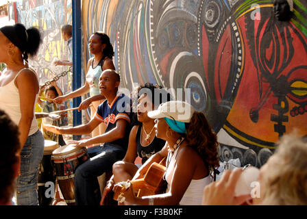 Street musicians and murals in Callejon de Hamel; Havana, Cuba Stock Photo