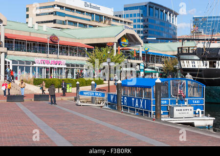 A water taxi waits for passengers at the Harborplace stop in the Inner Harbor in Baltimore, Maryland. Stock Photo