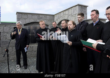 Lemnos island, Greece. 3rd October, 2015. Russian ecclesiastic choir performing live at the memorial service held for the fallen Russo-cossacks and Mr. Leonid Reshetnikov RISS (left) praying on Russo-Kozak memorial site. Lemnos, Greece. Credit:  BasilT/Alamy Live News Stock Photo