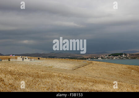 Lemnos island, Greece. 3rd October, 2015. Wide view of the Russian-Cossack graveyard locale in relation to Koutali village bay seen afar. Punta hill, Lemnos island, Greece. Credit:  BasilT/Alamy Live News Stock Photo
