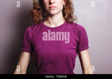 A young woman is wearing a purple top Stock Photo