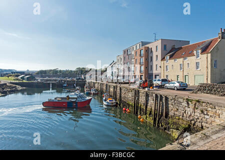 A fishing boat is arriving at the harbour in St. Andrews Fife Scotland with a catch Stock Photo