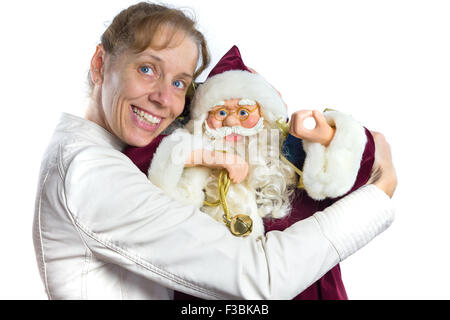 European woman embracing model of Santa Claus isolated on white background Stock Photo