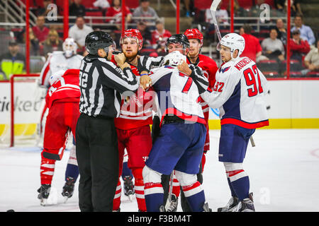 Washington Capitals and Carolina Hurricanes players fighting during the pre-season NHL game between the Washington Capitals and the Carolina Hurricanes at the PNC Arena. The Carolina Hurricanes defeated the Washington Capitals 4-3 in a shootout. Stock Photo