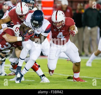 Palo Alto, CA. 3rd Oct, 2015. Stanford Cardinal linebacker Blake Martinez (4) makes a tackle on Arizona Wildcats running back Nick Wilson (28) during the NCAA Football game between the Stanford Cardinal and the Arizona Wildcats at Stanford Stadium in Palo Alto, CA. Stanford defeated Arizona 55-17. Damon Tarver/Cal Sport Media/Alamy Live News Stock Photo