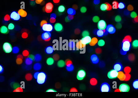 Abstract blurred effect Illuminated closeup of tangled Christmas lights Stock Photo