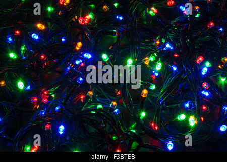 Illuminated closeup of tangled Christmas lights Stock Photo