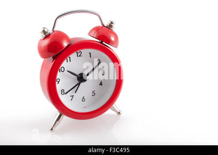 Alarm Clock. Classic red old style alarm clock isolated on white Stock Photo