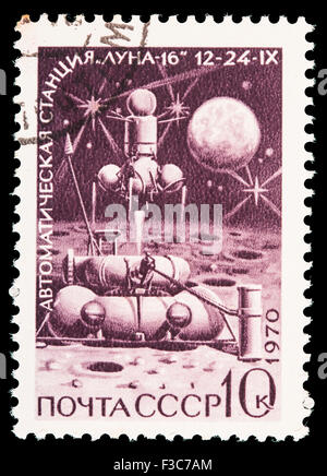 SOVIET UNION - CIRCA 1970: A postage stamp printed in Soviet Union shows a Lunar probe landing on the moon surface, circa 1970 Stock Photo