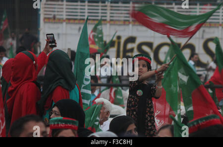Lahore, Pakistan. 04th Oct, 2015. A child waving flag during the supporters of Pakistani opposition leader Imran Khan, head of opposition party Pakistan Tehreek-e-Insaf (PTI) gather the election campaign for the lower house of the parliament National Assembly in Lahore. © Rana Sajid Hussain/Pacific Press/Alamy Live News Stock Photo