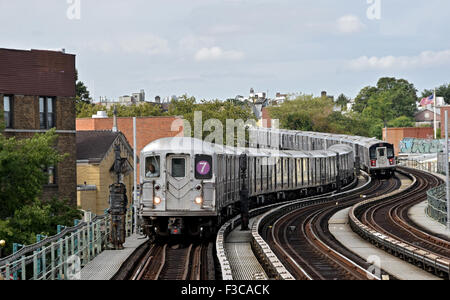 A view of two elevated subway trains from the 61st street station of the #7 train in Woodside, Queens, New York Stock Photo