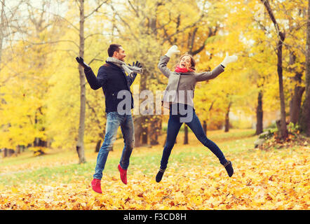 smiling couple having fun in autumn park Stock Photo
