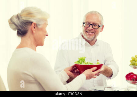 smiling senior couple having dinner at home Stock Photo