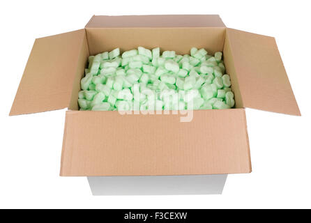 The big white cardboard box is filled with green bubbly plastic protective granules. Isolated with patch Stock Photo