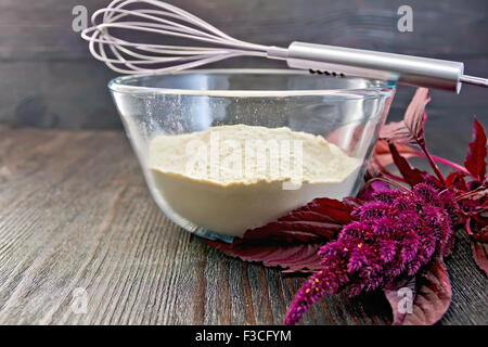 Flour amaranth in glass bowl on board Stock Photo