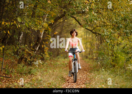 woman riding in park Stock Photo