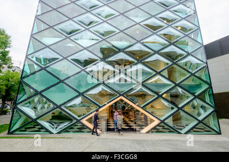 Exterior of glass walled Prada flagship store in Aoyama Tokyo Japan Stock Photo