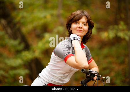 woman riding in park Stock Photo