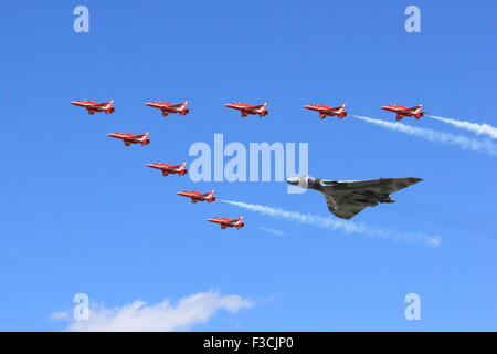 Last flight of Vulcan Bomber and Red Arrows at Royal International Air Tattoo 2015 (RIAT) in formation Stock Photo