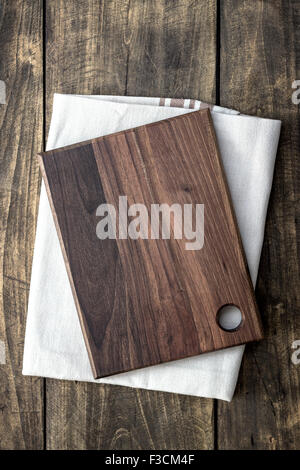 Empty cutting board on napkin , from above Stock Photo