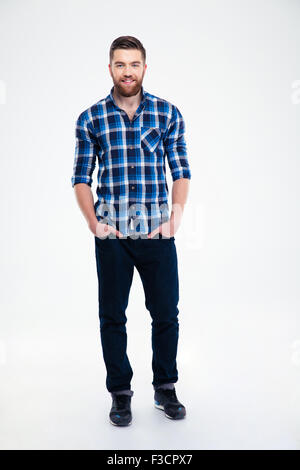Full length portrait of a cheerful handsome man standing isolated on a white background Stock Photo