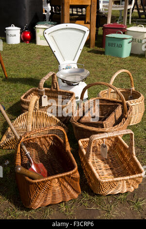 UK, England, Lincolnshire, Lincoln, Antiques Fair, wicker baskets and old sweet shop scales Stock Photo