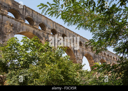 Pont du Gard, ancient Roman aqueduct in France - detail in between trees Stock Photo