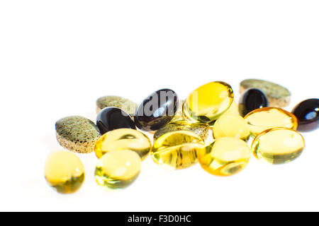 Different colored medicine and types of pills isolated on a white  background. Stock Photo