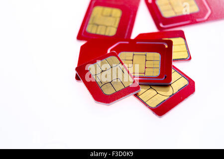 Stack of red sim card on white  background Stock Photo