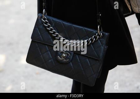 PARIS - SEPTEMBER 30: Black leather Chanel bag before Yang Li show, Paris Fashion Week Day 2, Spring / Summer 2016 street style Stock Photo